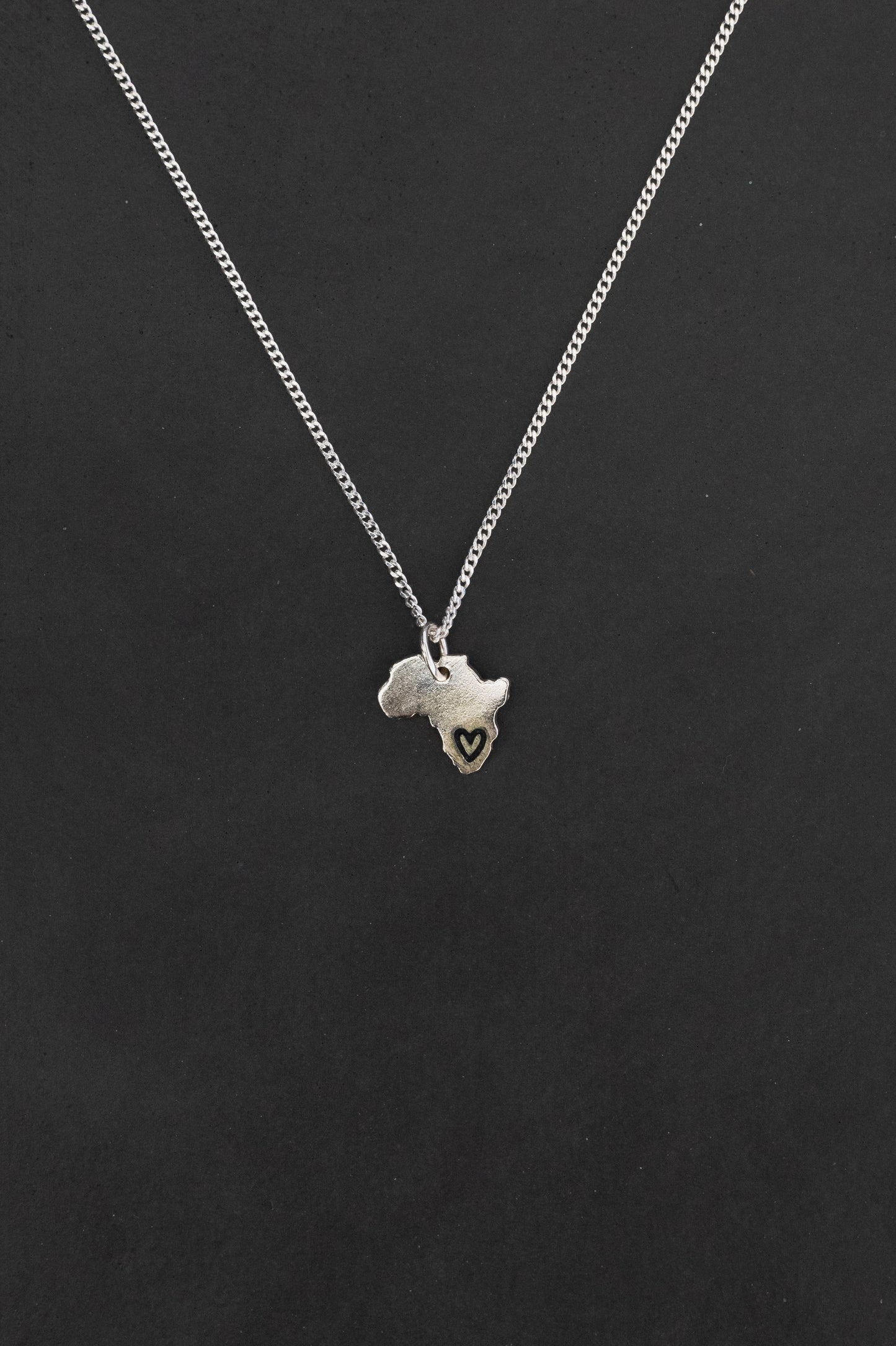 Solid Africa Map Pendant with Black Heart Design Engraved