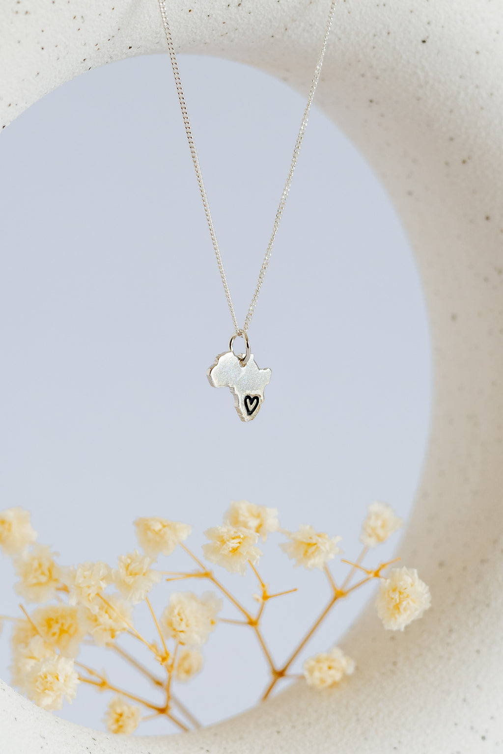 Solid Africa Map Pendant with Black Heart Design Engraved