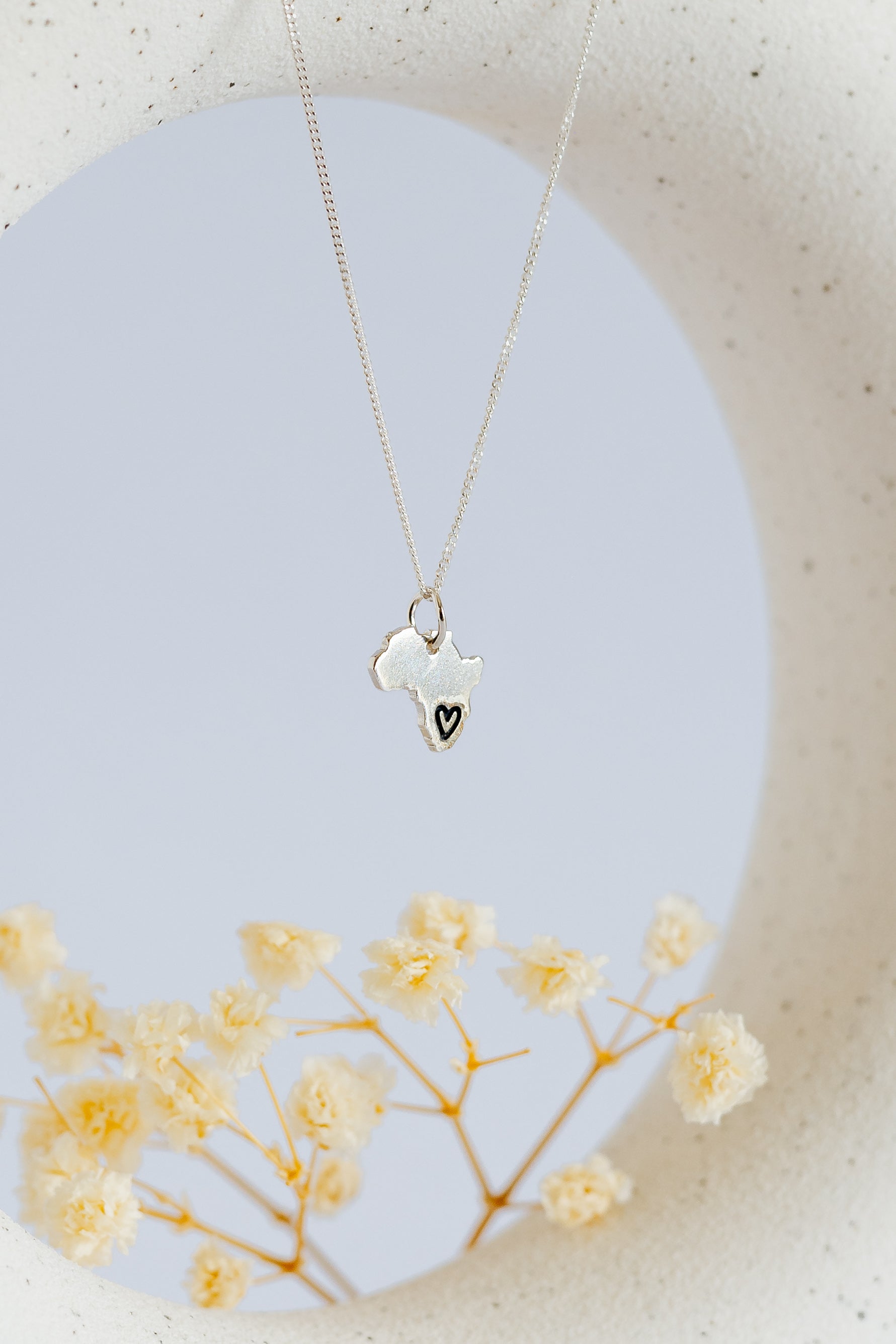 Solid Africa Map Pendant with Black Heart Design Engraved