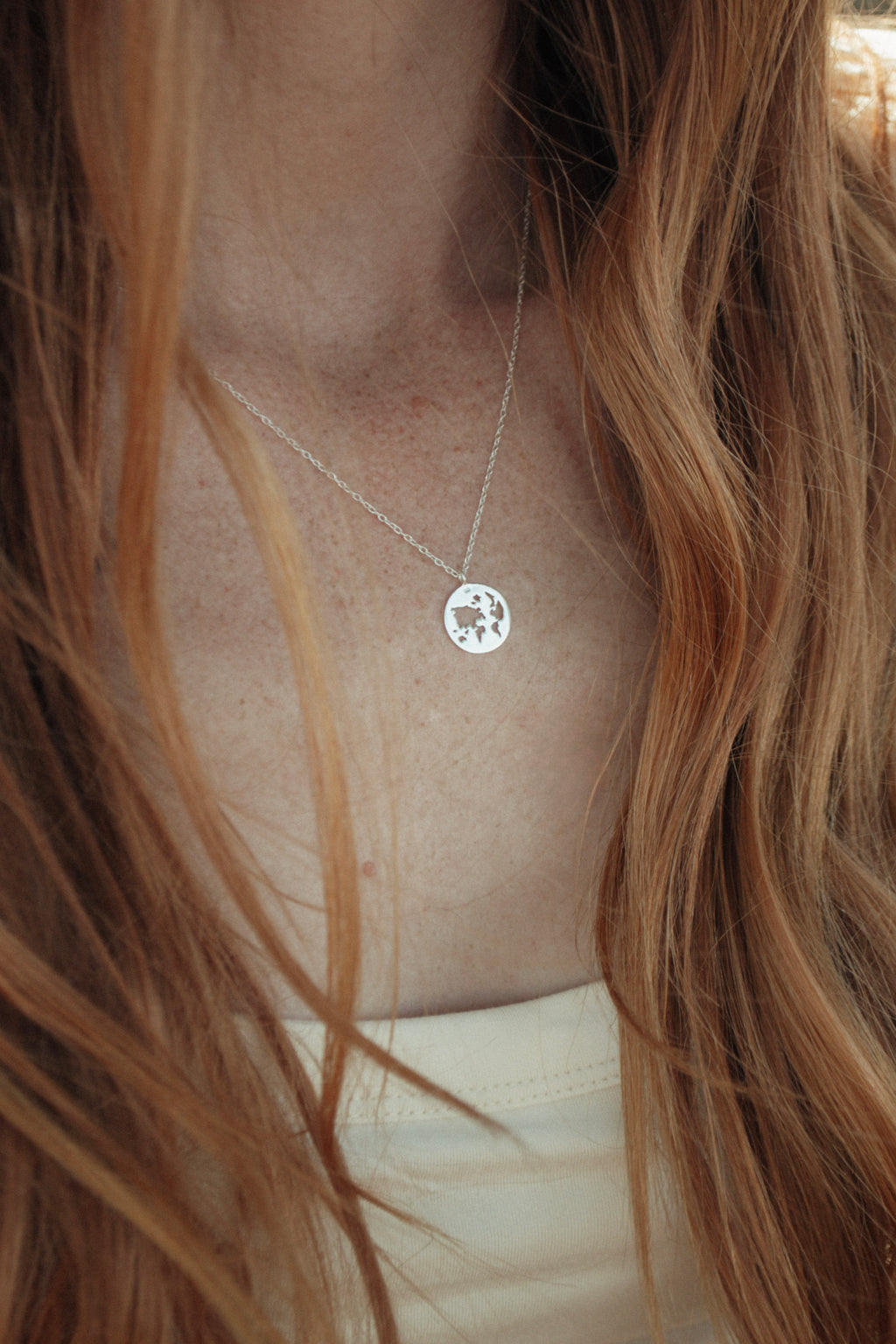 World Map Cutout Pendant