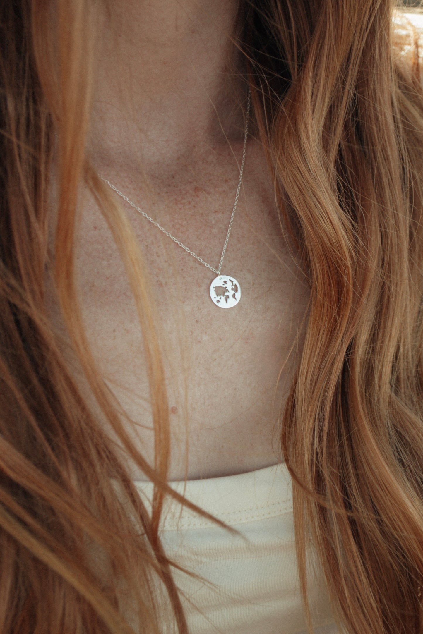 World Map Cutout Pendant
